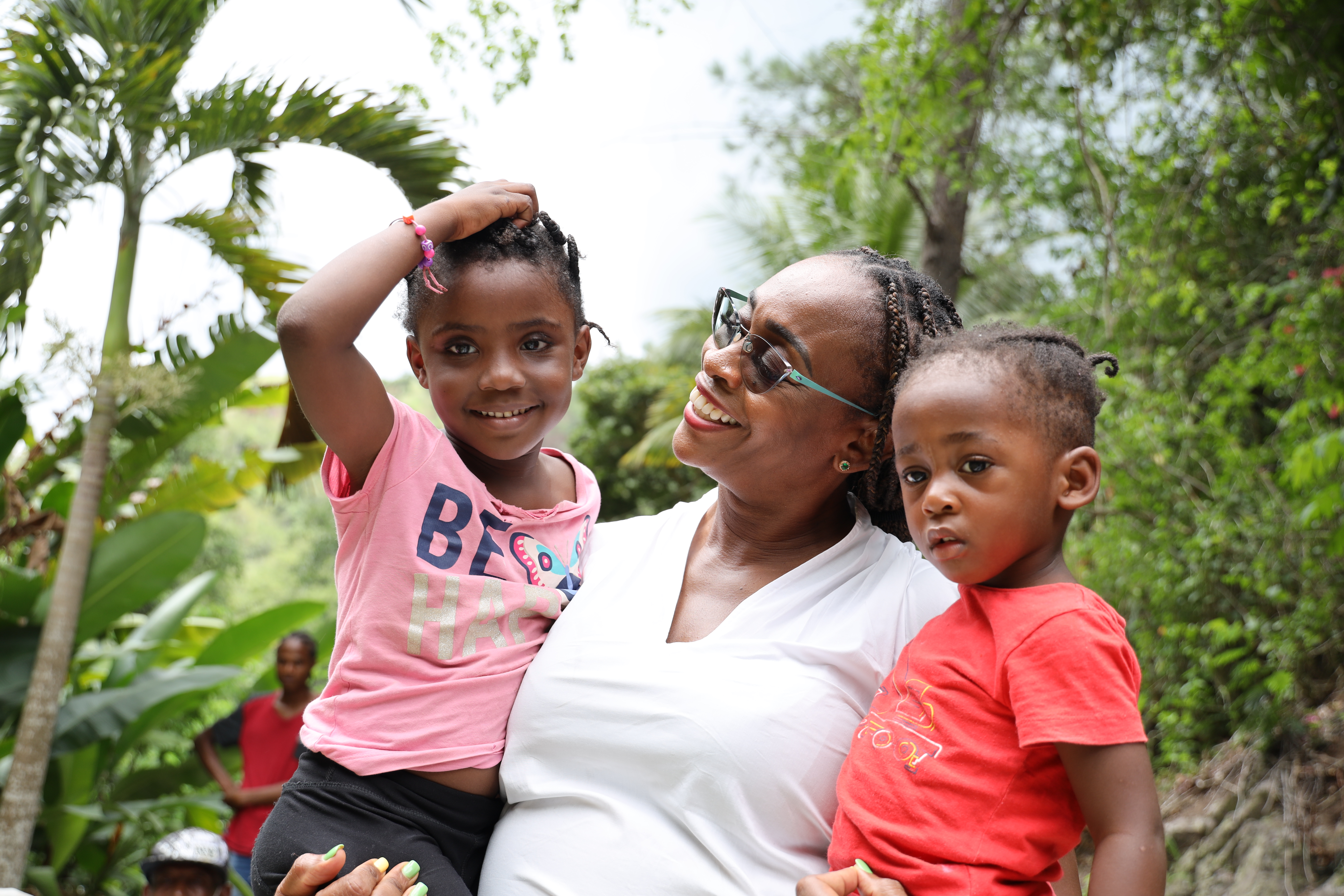 Holding two children
